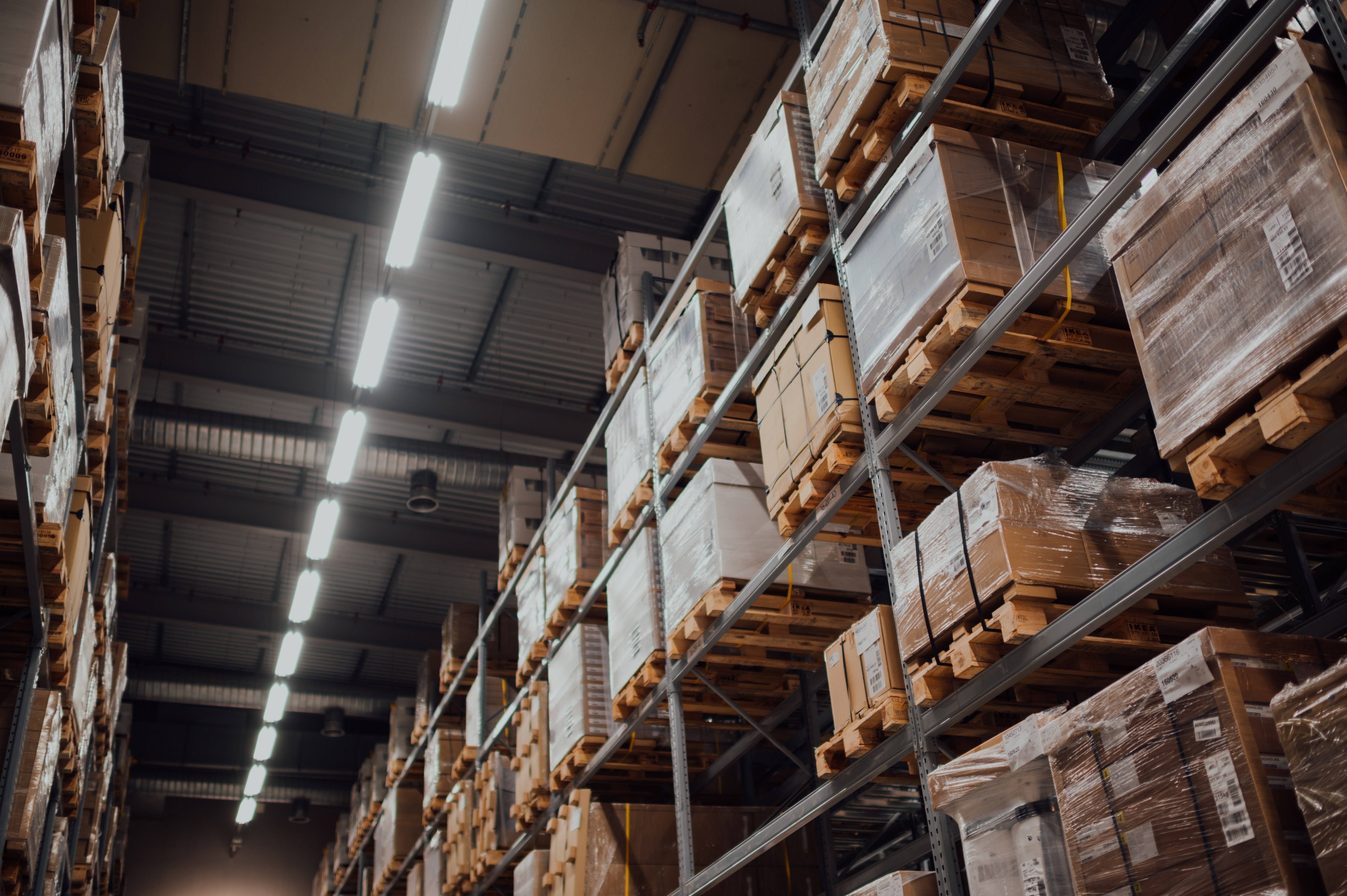 Warehouse with shelves and inventory, supply chain technology